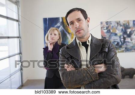 Stock Photo - People looking at art in art gallery. Fotosearch