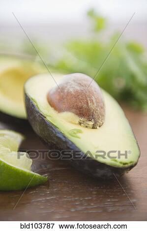 Pit in avocado half View Large Photo Image Stock Photo - Pit in avocado half. Fotosearch