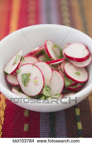 Sliced radishes in bowl View Large Photo Image Picture - Sliced radishes in bowl. Fotosearch