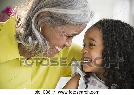 Stock Photo - Smiling African American grandmother and granddaughter. Fotosearch