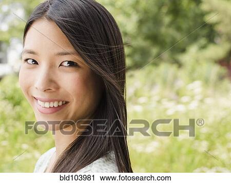 Stock Image - Smiling Asian woman. Fotosearch