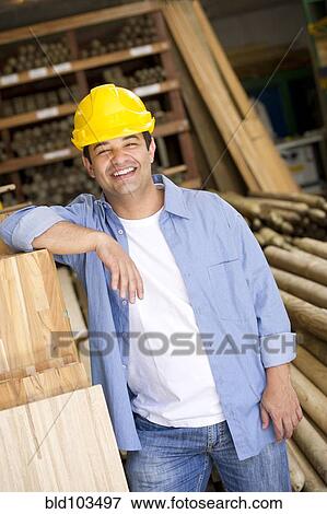 Stock Photo - Smiling Hispanic carpenter. Fotosearch