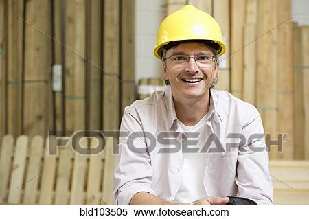 Stock Photography - Smiling Hispanic carpenter. Fotosearch