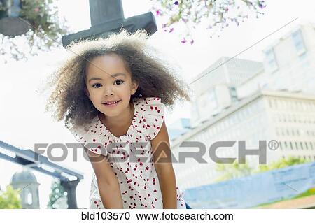Stock Image - Smiling mixed race girl. Fotosearch