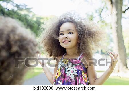 Smiling mixed race girl View Large Photo Image Stock Image - Smiling mixed race girl. Fotosearch