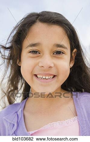 Smiling mixed race girl View Large Photo Image Stock Image - Smiling mixed race girl. Fotosearch