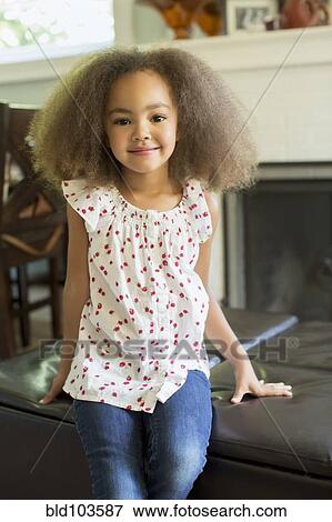 Stock Photo - Smiling mixed race girl. Fotosearch