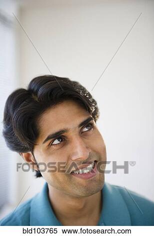 Stock Photography - Smiling mixed race man. Fotosearch