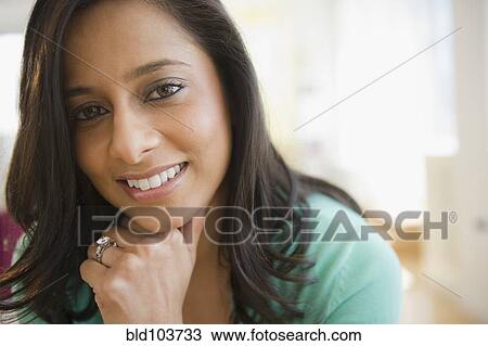 Stock Image - Smiling mixed race woman. Fotosearch