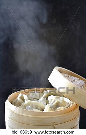 Stock Photo - Steamed Asian dumplings. Fotosearch