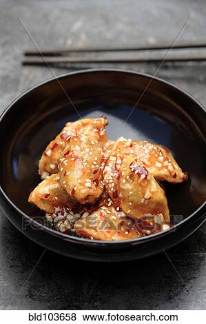 Sweet and sour Asian dumplings View Large Photo Image Stock Photo - Sweet and sour Asian dumplings. Fotosearch