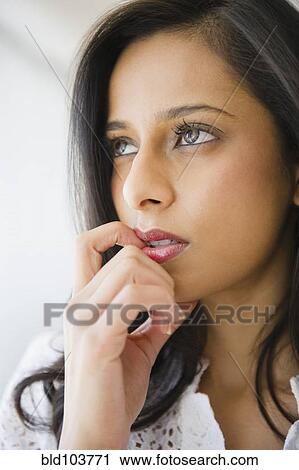 Uncertain mixed race woman View Large Photo Image Stock Image - Uncertain mixed race woman. Fotosearch