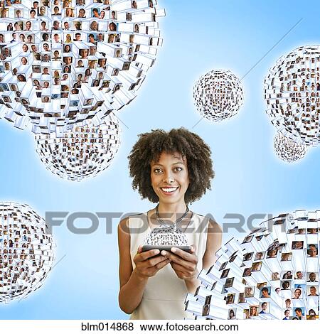 African American woman using cell phone with images floating above View Large Photo Image Stock Photo - African American woman using cell phone with images floating above. Fotosearch