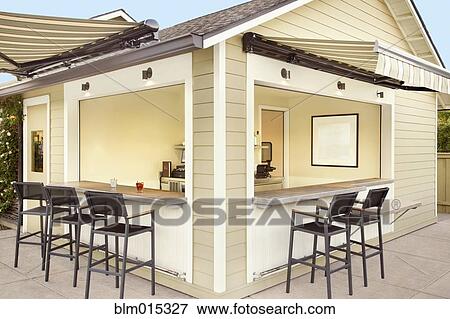 Stock Photo - Bar and bar stools on patio. Fotosearch
