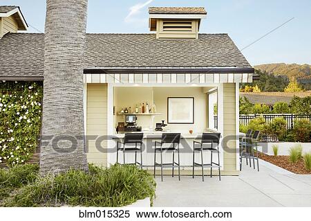 Stock Photography - Bar and bar stools on patio. Fotosearch