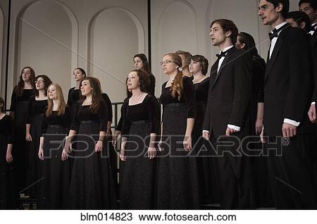 Stock Image - Caucasian choir performing on stage. Fotosearch
