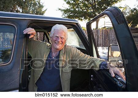 Caucasian man sitting in truck View Large Photo Image Stock Image - Caucasian man sitting in truck. Fotosearch