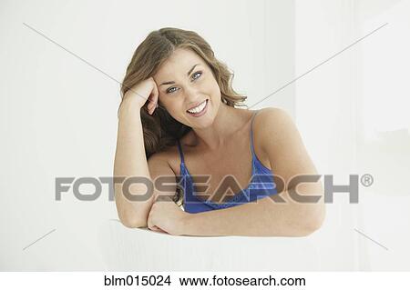 Picture - Caucasian woman with head in hands. Fotosearch