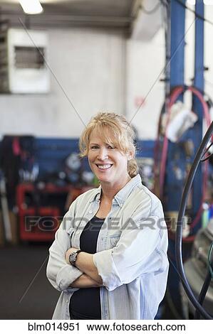 Caucasian worker in auto repair shop View Large Photo Image Stock Image - Caucasian worker in auto repair shop. Fotosearch