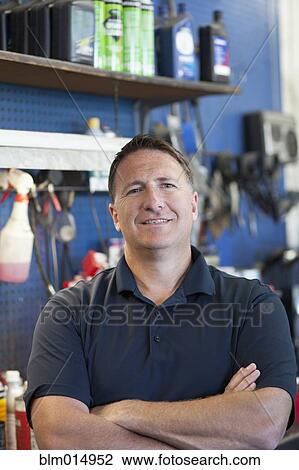Caucasian worker in auto repair shop View Large Photo Image Stock Image - Caucasian worker in auto repair shop. Fotosearch