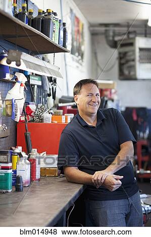 Caucasian worker in auto repair shop View Large Photo Image Stock Photo - Caucasian worker in auto repair shop. Fotosearch