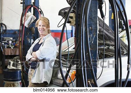 Stock Photograph - Caucasian worker in auto repair shop. Fotosearch