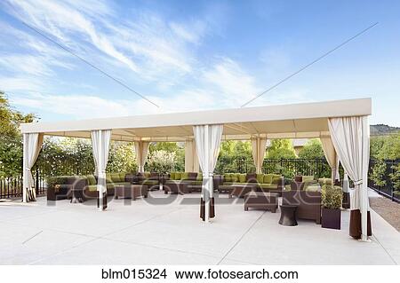 Picture - Elegant furniture on covered patio. Fotosearch