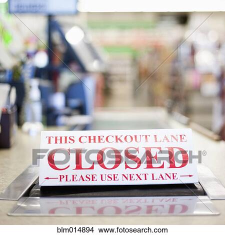 Picture - Grocery store check out lane closed sign. Fotosearch