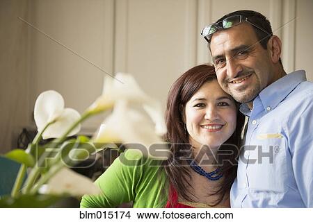 Picture - Hispanic couple hugging. Fotosearch