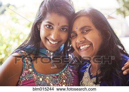 Indian mother and daughter in traditional clothing View Large Photo Image Picture - Indian mother and daughter in traditional clothing. Fotosearch