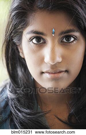 Indian woman with traditional jewel on forehead View Large Photo Image Stock Image - Indian woman with traditional jewel on forehead. Fotosearch