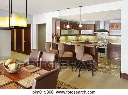 Stock Photograph - Interior of elegant kitchen and dining room. Fotosearch