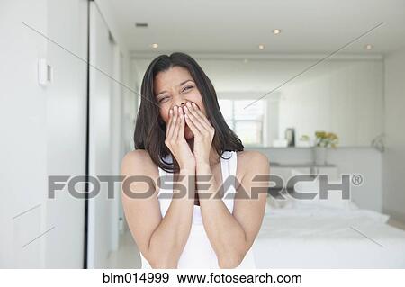 Stock Photo - Laughing Hispanic woman. Fotosearch