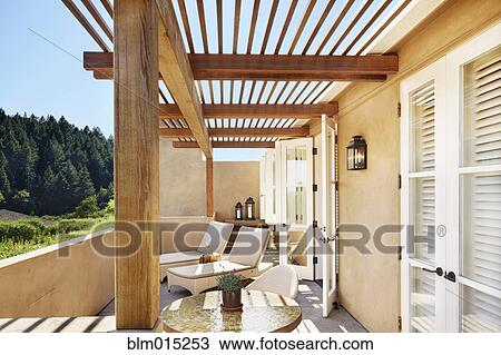 Stock Image - Lounge chairs on patio. Fotosearch