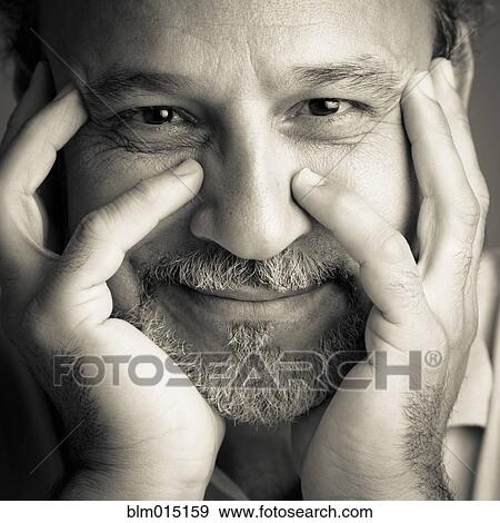 Middle Eastern man with head in hands View Large Photo Image Stock Photo - Middle Eastern man with head in hands. Fotosearch