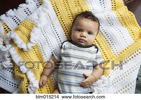 Mixed race baby laying on blanket View Large Photo Image Picture - Mixed race baby laying on blanket. Fotosearch