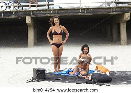 Mixed race friends enjoying beach View Large Photo Image Picture - Mixed race friends enjoying beach. Fotosearch