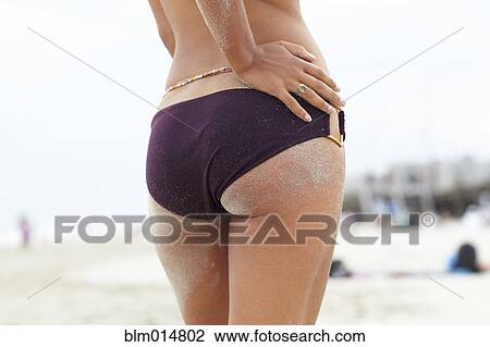 Mixed race woman with sand on her buttocks View Large Photo Image Stock Image - Mixed race woman with sand on her buttocks. Fotosearch