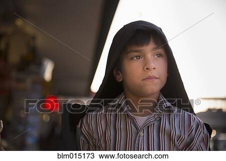 Stock Image - Serious Hispanic boy. Fotosearch