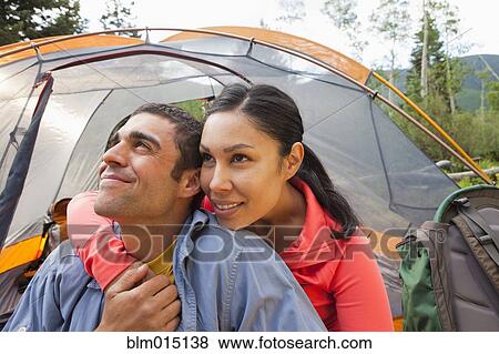 Smiling couple camping together View Large Photo Image Stock Photo - Smiling couple camping together. Fotosearch