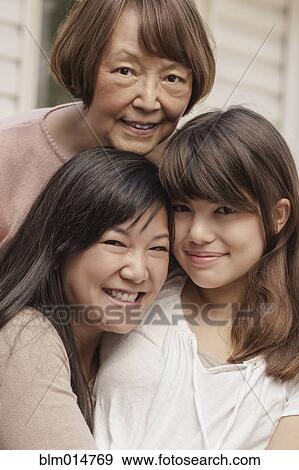 Smiling grandmother, mother and daughter View Large Photo Image Stock Photo - Smiling grandmother, mother and daughter. Fotosearch
