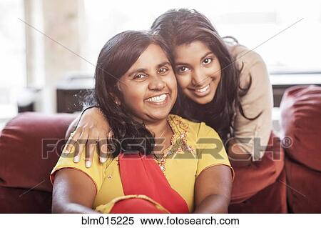 Stock Photography - Smiling Indian mother and daughter. Fotosearch