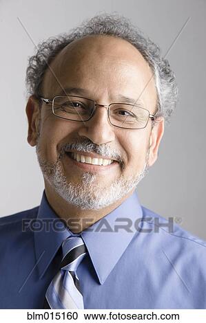 Stock Image - Smiling Middle Eastern businessman. Fotosearch