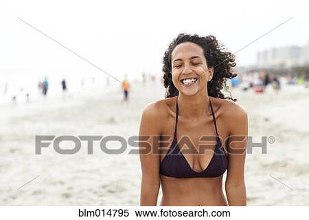 Smiling mixed race woman on beach View Large Photo Image Stock Photography - Smiling mixed race woman on beach. Fotosearch