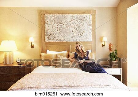 Woman drinking wine in elegant bedroom View Large Photo Image Stock Image - Woman drinking wine in elegant bedroom. Fotosearch