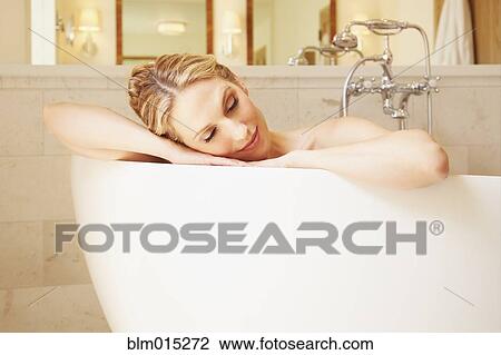 Woman soaking in bathtub View Large Photo Image Stock Image - Woman soaking in bathtub. Fotosearch