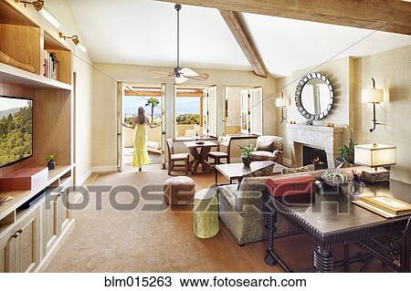 Woman standing in elegant living room View Large Photo Image Stock Image - Woman standing in elegant living room. Fotosearch