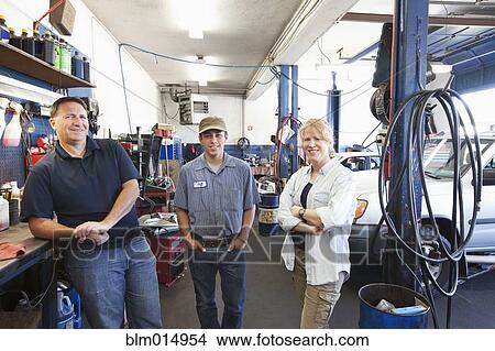 Workers in auto repair shop View Large Photo Image Picture - Workers in auto repair shop. Fotosearch