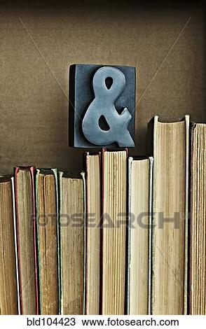 Ampersand sign on top of books View Large Photo Image Stock Image - Ampersand sign on top of books. Fotosearch