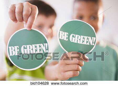 Boys holding Be Green signs View Large Photo Image Stock Photo - Boys holding Be Green signs. Fotosearch